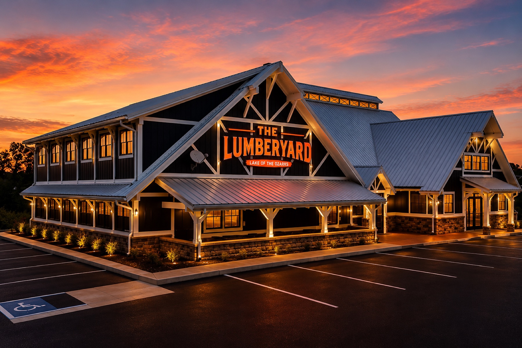 The Lumber Yard restaurant at sunset with the signature signage lit up